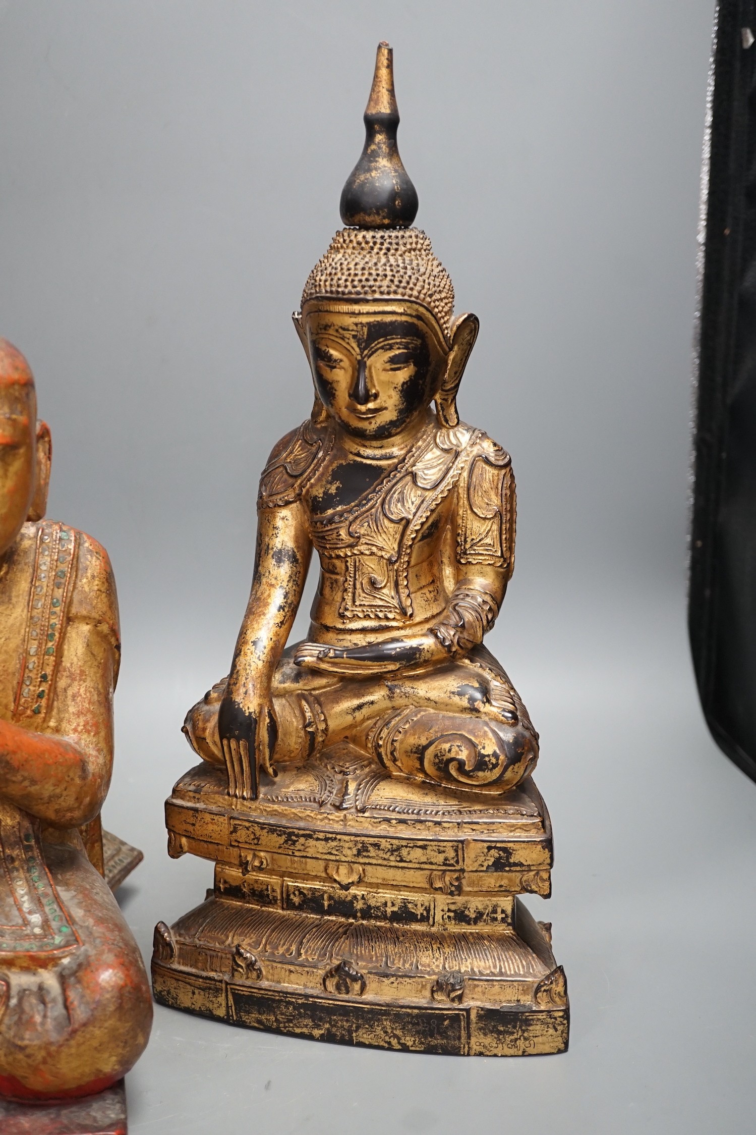 Two Thai gilt wood figures of Buddha, tallest 41cms high